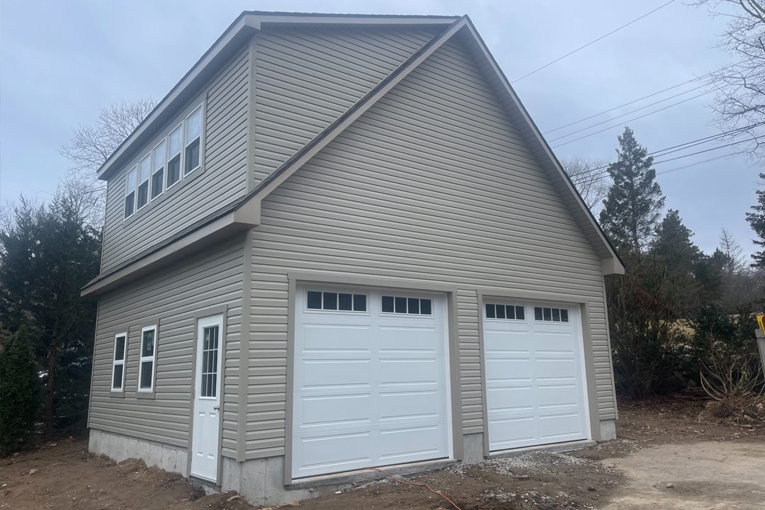 Large two car garage with secure overhead garage doors and a 