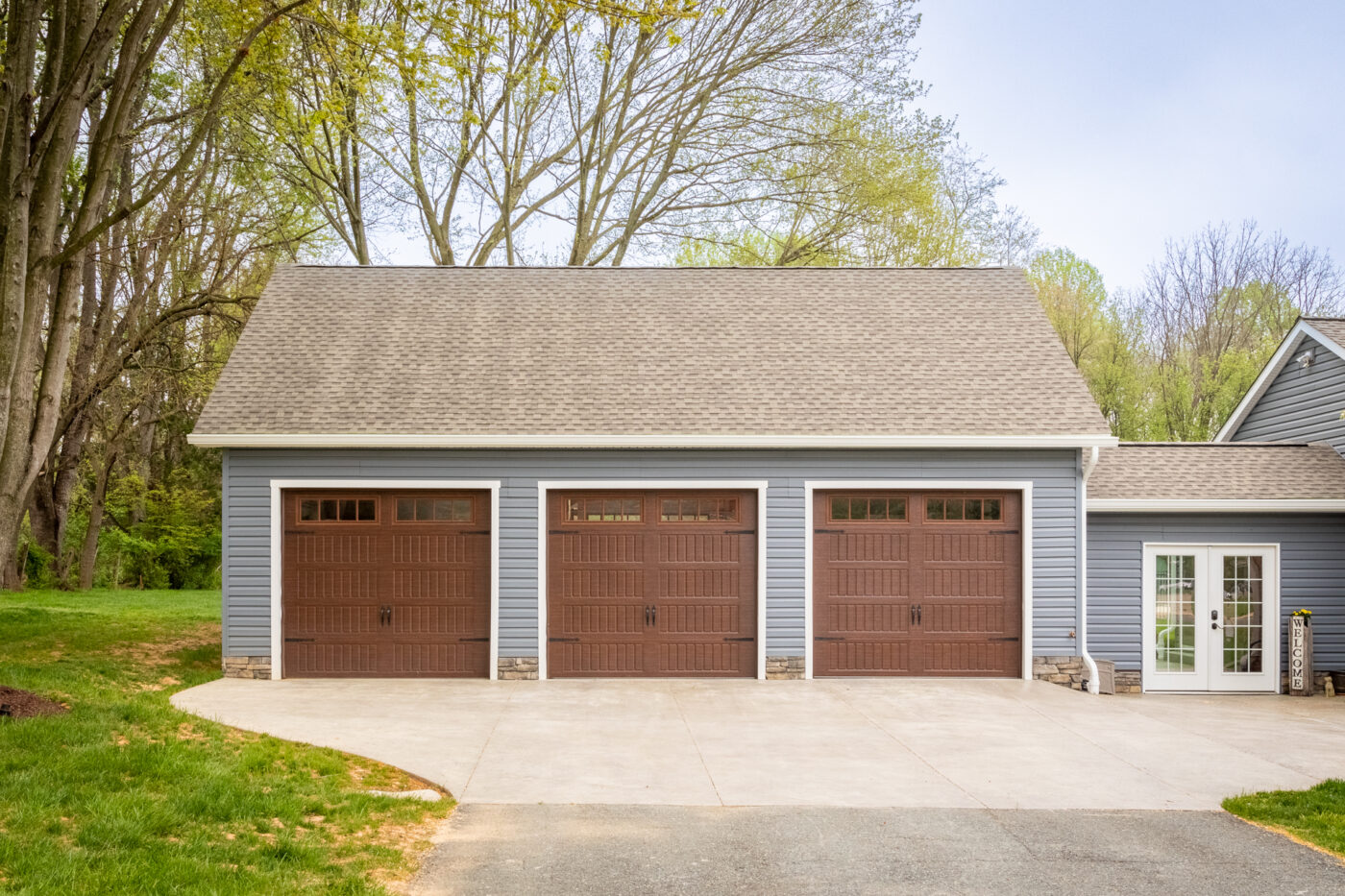 exterior of brown and blue 3 car prefab garage for sale in nj