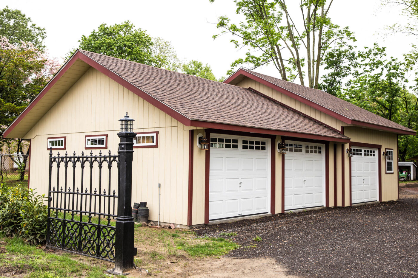 tan 3-car garage with red trim for sale in Delaware
