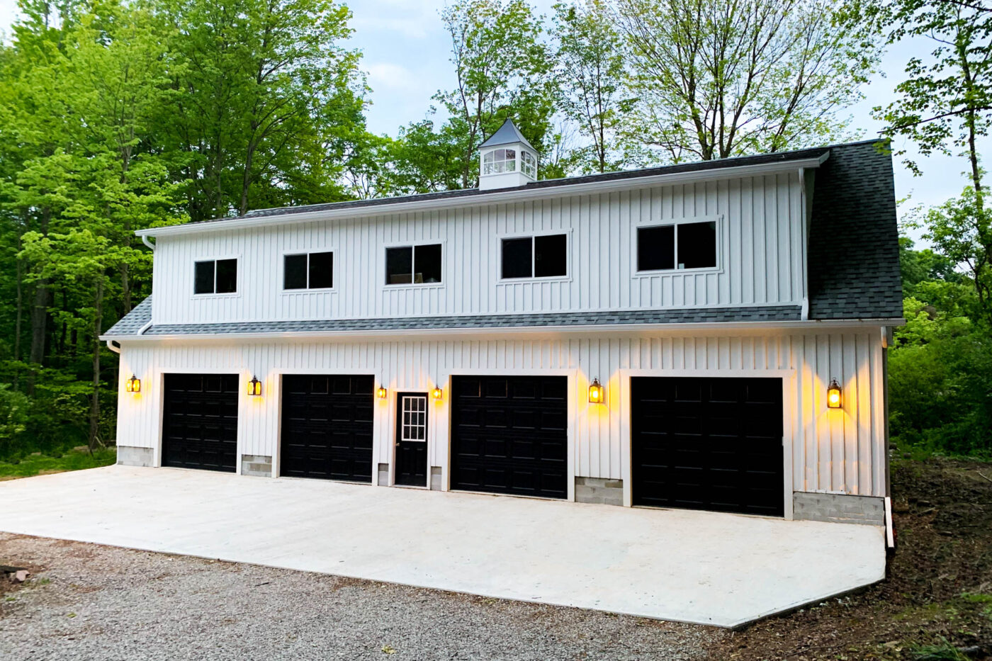 white 4-car 2-story garage with black doors for sale in Delaware