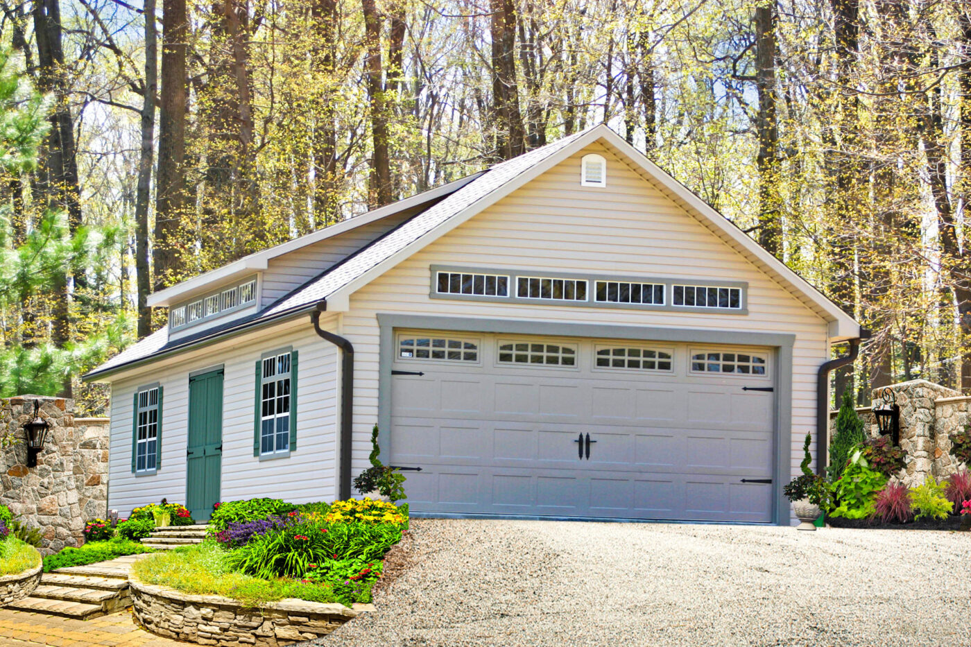a white 2-car garage with green shutters, gray garage door, and green entrance door for sale in Lynn, MA