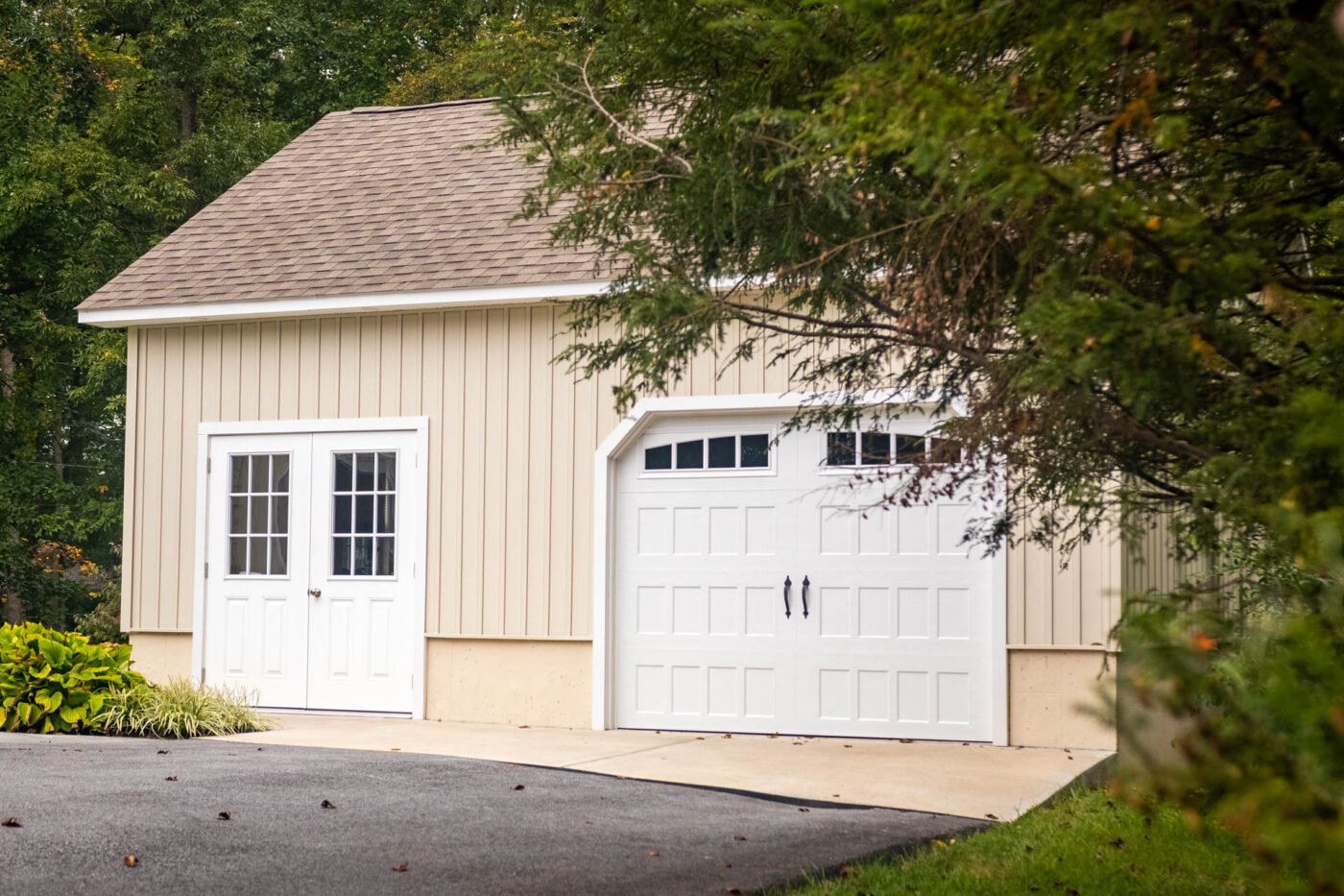 tan garage with double walk doors for sale in Raleigh, NC
