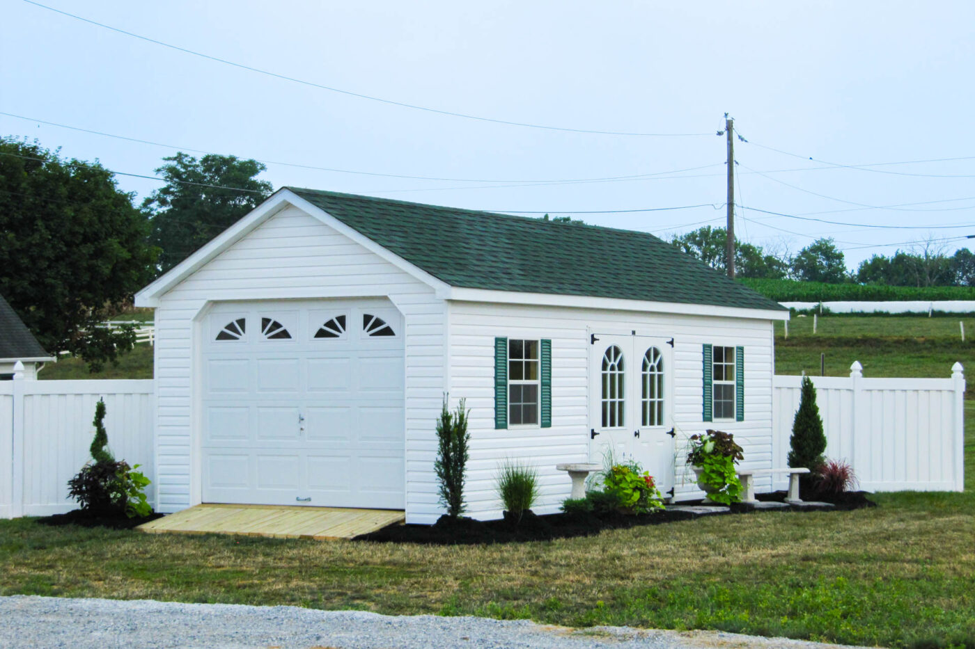 small white single-car garage with green shutters for sale in Syracuse, NY