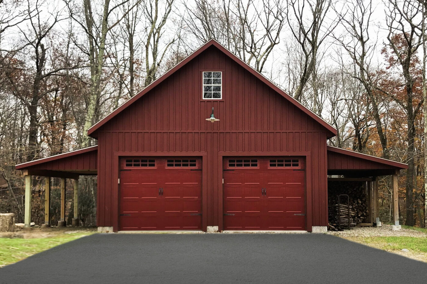 red garage with side overhangs and two red garage doors with transom windows