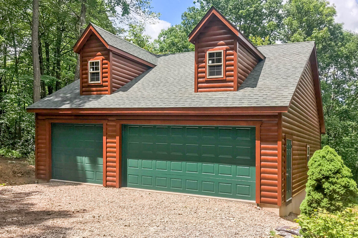 a log sided 3-car garage with green garage doors for sale in Alexandria, VA