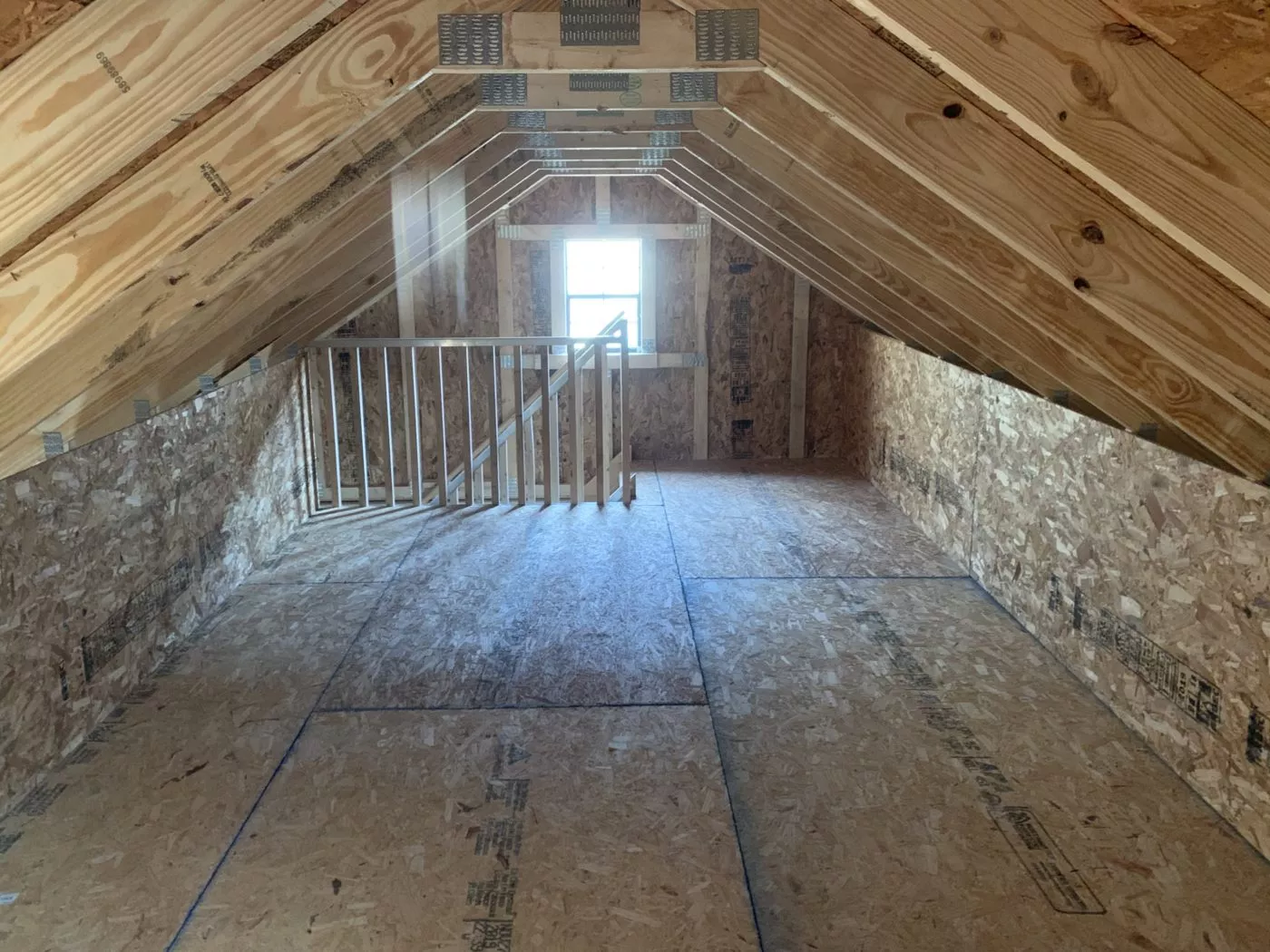 interior snapshot of attic for attic workshop two-car garage