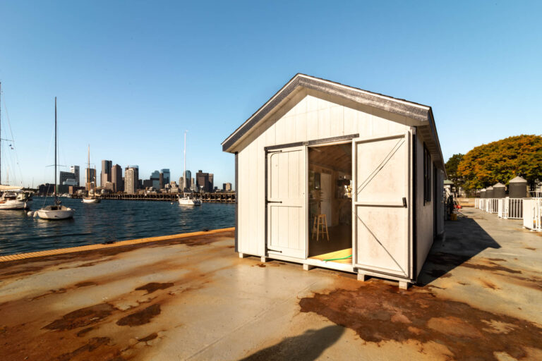 A white 10x28 shed in East Boston, MA.