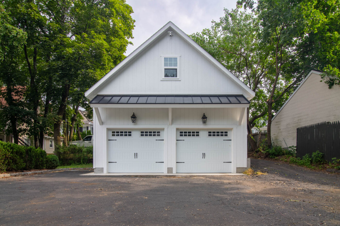 a White 24x20 Attic Workshop 2-Car Garage with wood siding and a rear hip roof in Greenwich, CT built by Sheds Unlimited