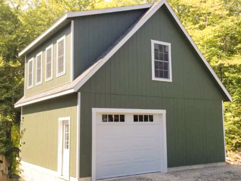 the exterior of a Legacy 2-Story Workshop 2-Car Garage in Vienna, ME with pequea green wood siding and white trim