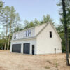 the exterior of a white 2-story Workshop 2-car Garage with black garage doors and a grey roof in Acton, ME