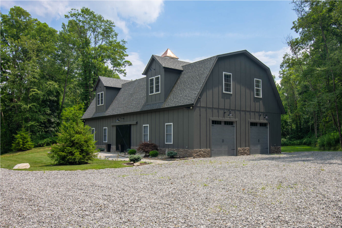 a custom painted 34x68 Legacy 2-Story MaxiBarn 2-Car Garage with 2 dormers and a cupola built by Sheds Unlimited in Holmes, NY
