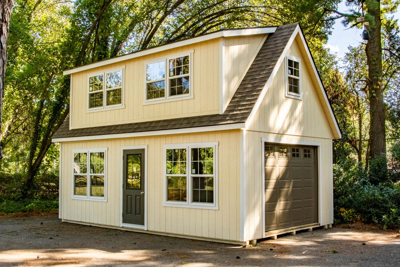 yellow multi-story garage built in accordance with garage permits in Vermont