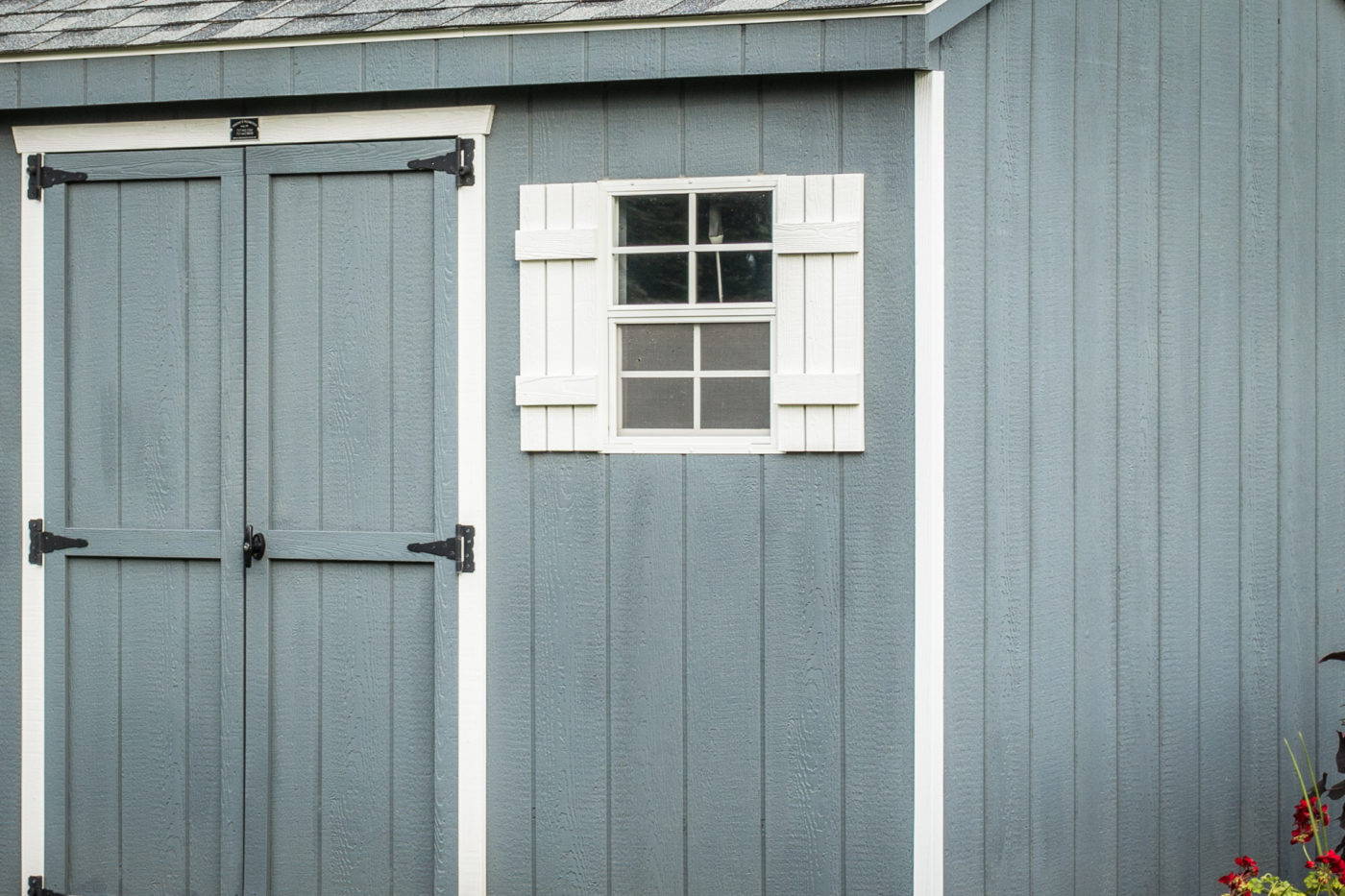 A shed with wood siding