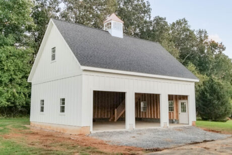 a white legacy 2-story 3-car garage