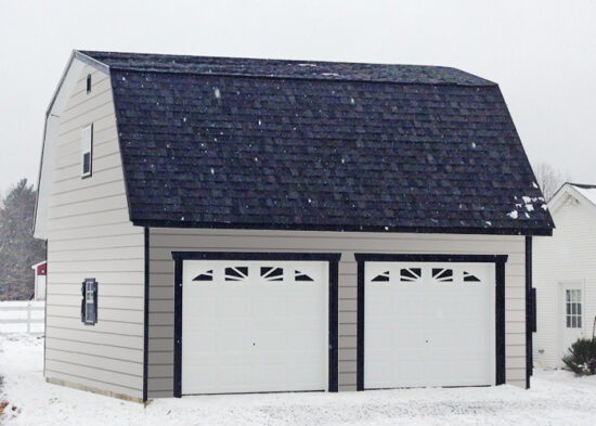 two story car garage pa with gray clapboard siding