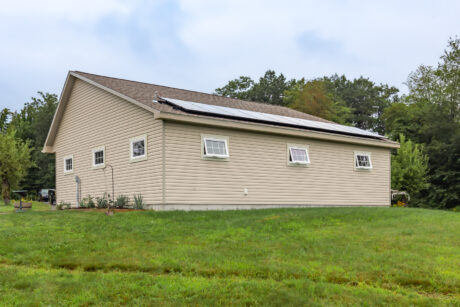 A 28-36 single-story standard saltbox two-car garage in Wilton, NH