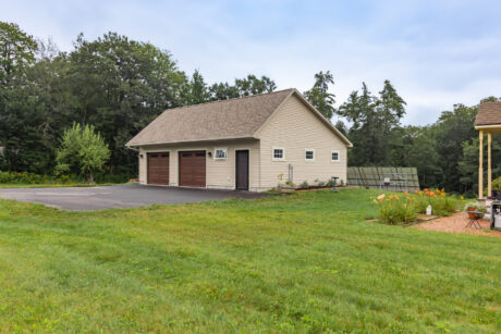 A 28-36 single-story standard saltbox two-car garage in Wilton, NH