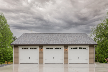 tan and white trimmed 28x38 multi car garage in bostic, NC