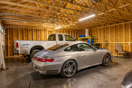 three vehicles inside a 28x38 3-car garage