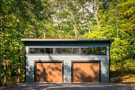 A modern 2-car garage with brown modern garage doors