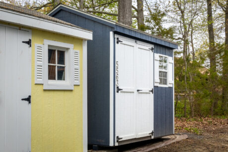 8x8 shed with blue wooden siding in a forest in churchton md 4