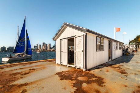 A 10x28 shed with black trim in East Boston, MA.