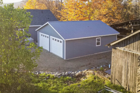 A 24x32 garage in Newark, VT, with a metal roof.
