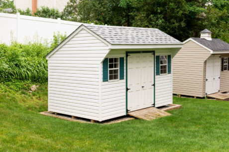 An 8x12 saltbox shed in Berwyn, PA with green shutters.