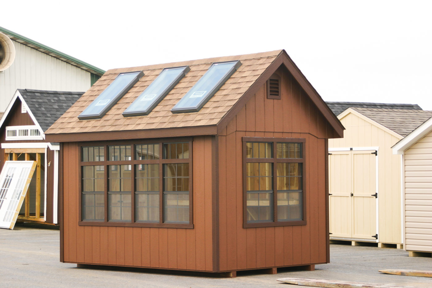 exterior of sheds with 100 sq ft of space for sale
