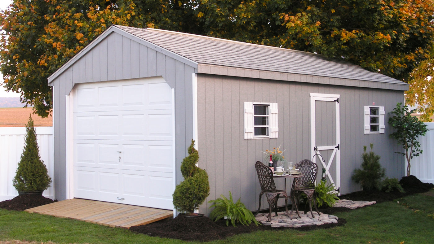 outside photo of simple single car amish built garage for sale
