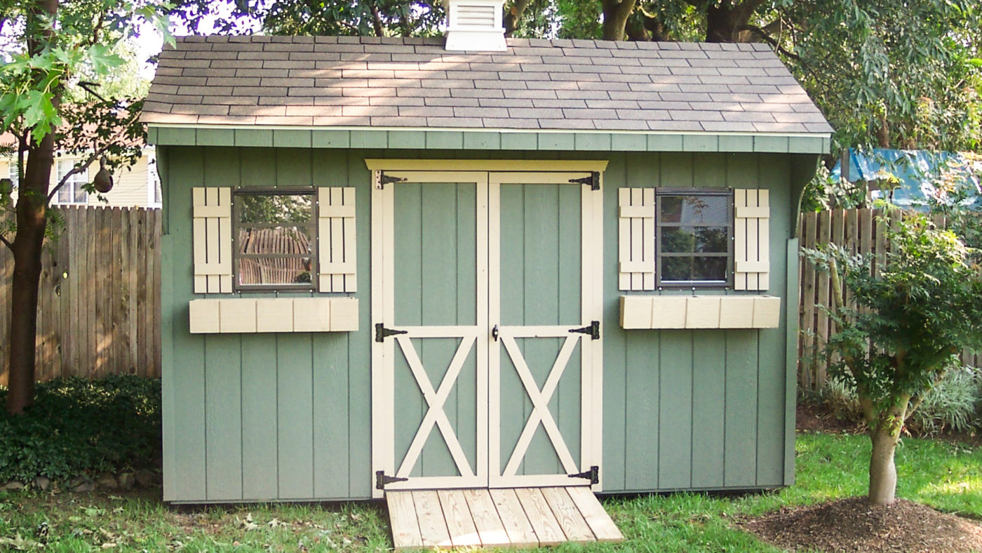exterior of green wooden outdoor bike shed for sale