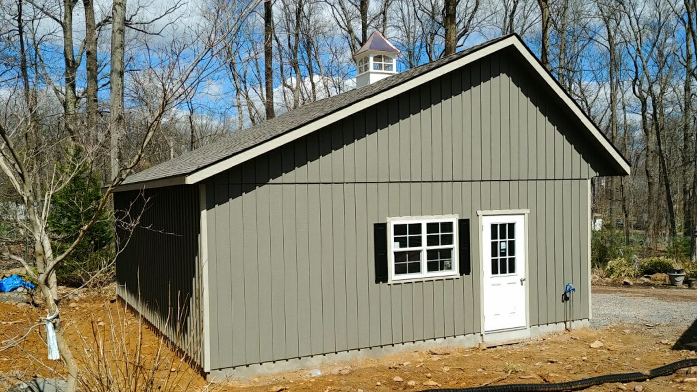 exterior of green saltbox garage board and batten for sale