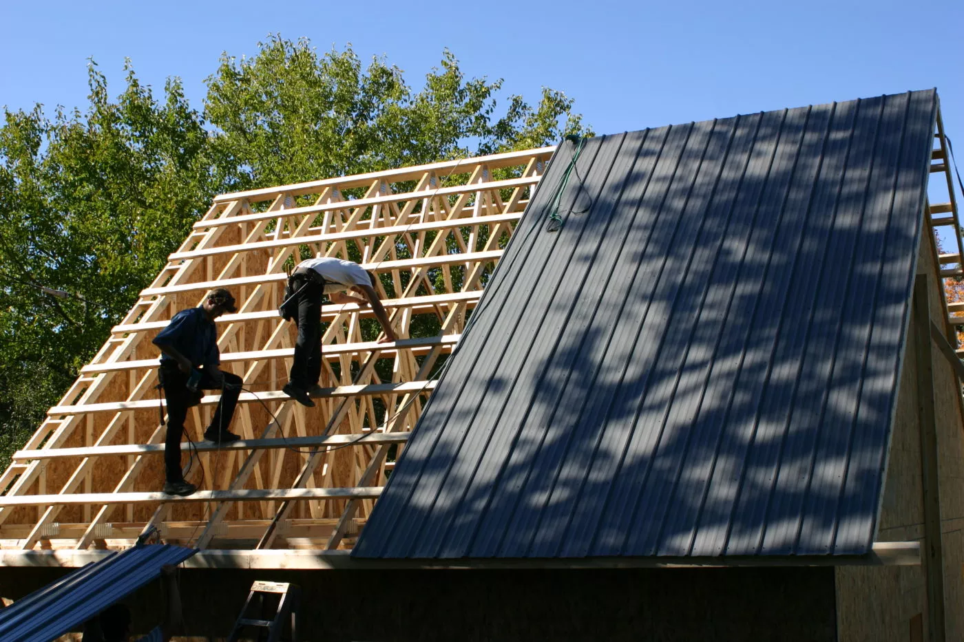 two men constructing a detached garage