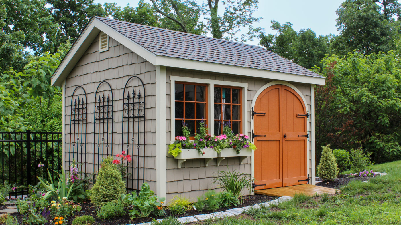 exterior of orange-doored shed for insulated sheds for sale article