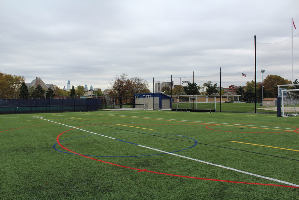 exterior of a quality sports equipment shed by a turf field