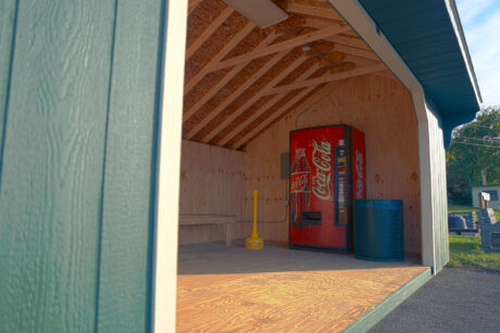 wooden saltbox soda machine shed