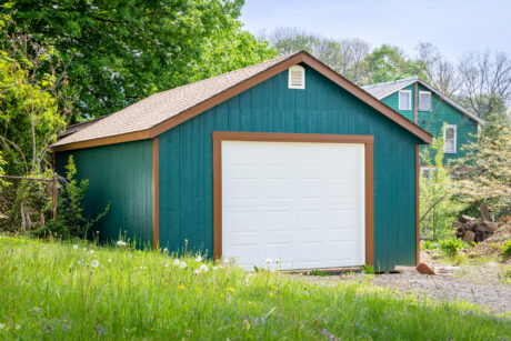 16x24 garage with blue wood siding and trees in sharon hill pa 2