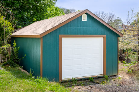 16x24 garage with blue wood siding and trees in sharon hill pa 2