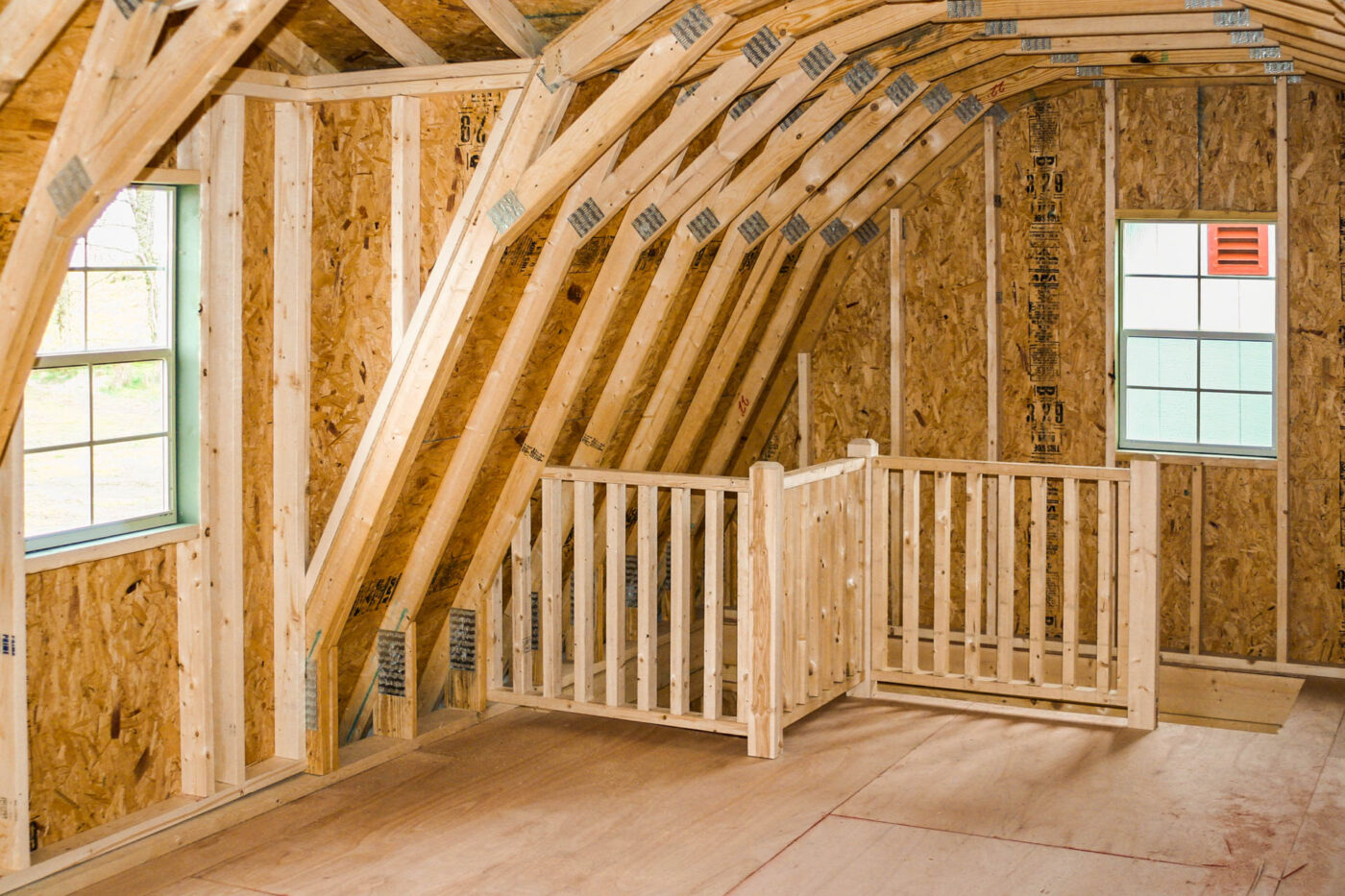 The interior of a maxibarn garage with attic trusses.