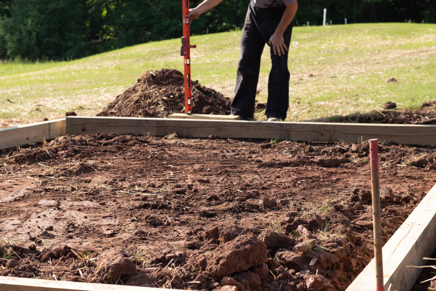 making sure that a gravel shed pad is level