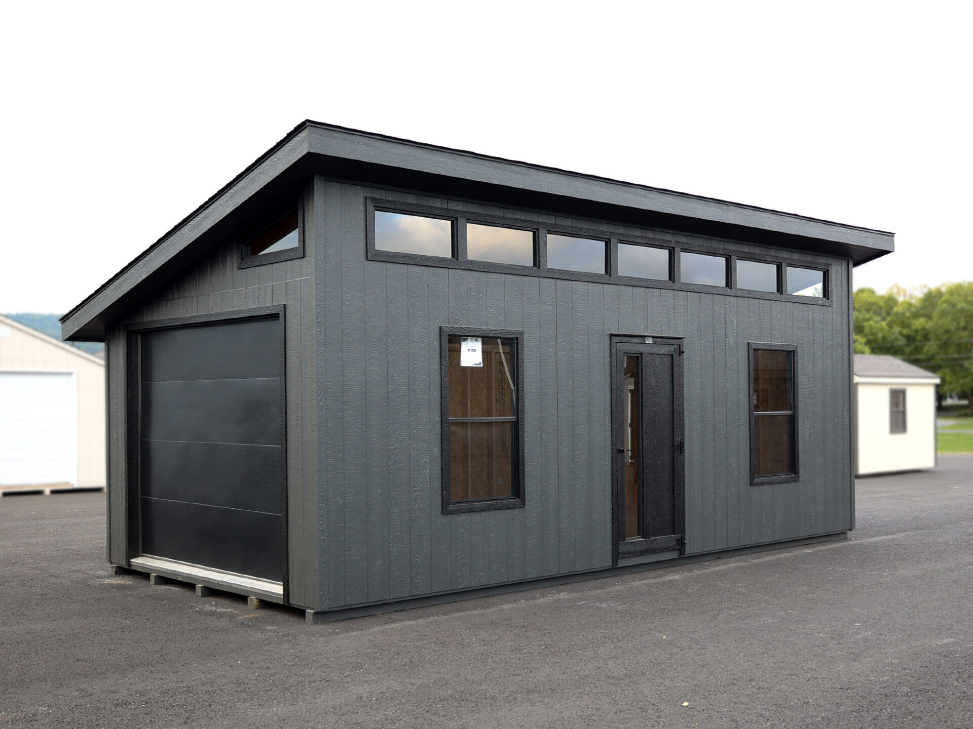gray and black trimmed modern one car garage