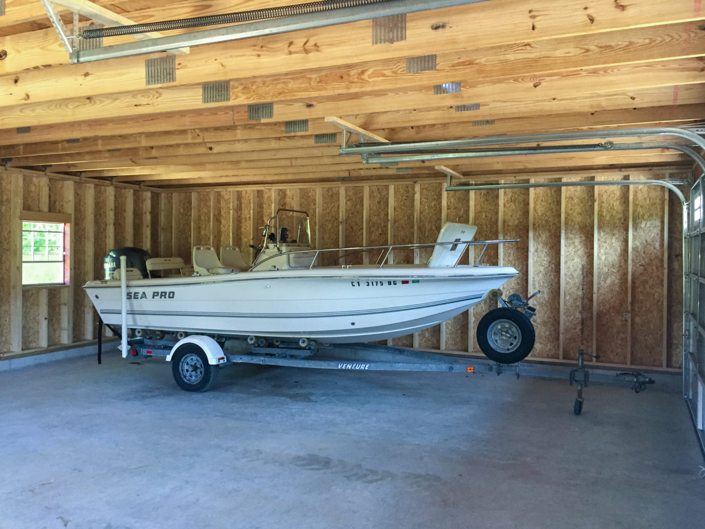 2 car garage man cave with boat